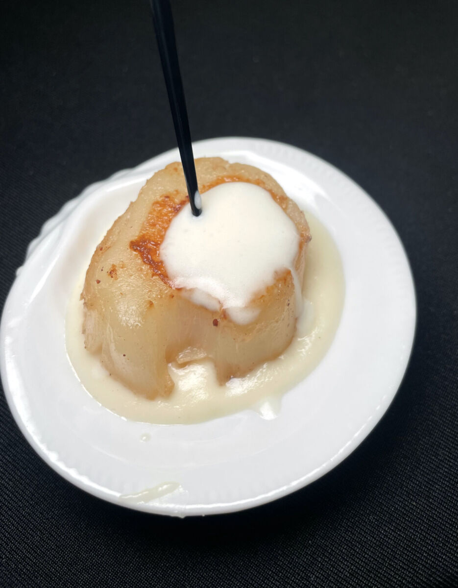 Callo de hacha en salsa de vino blanco